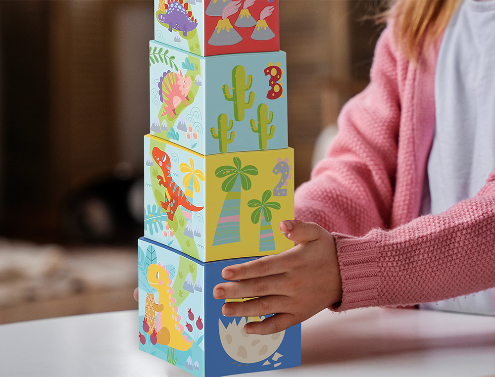 JOGO INFANTIL IMAGINOVO CUBOS EMPILHAVEIS NINHOS DINOSSAUROS +12 MESES 12 PECAS 13X13X13CM